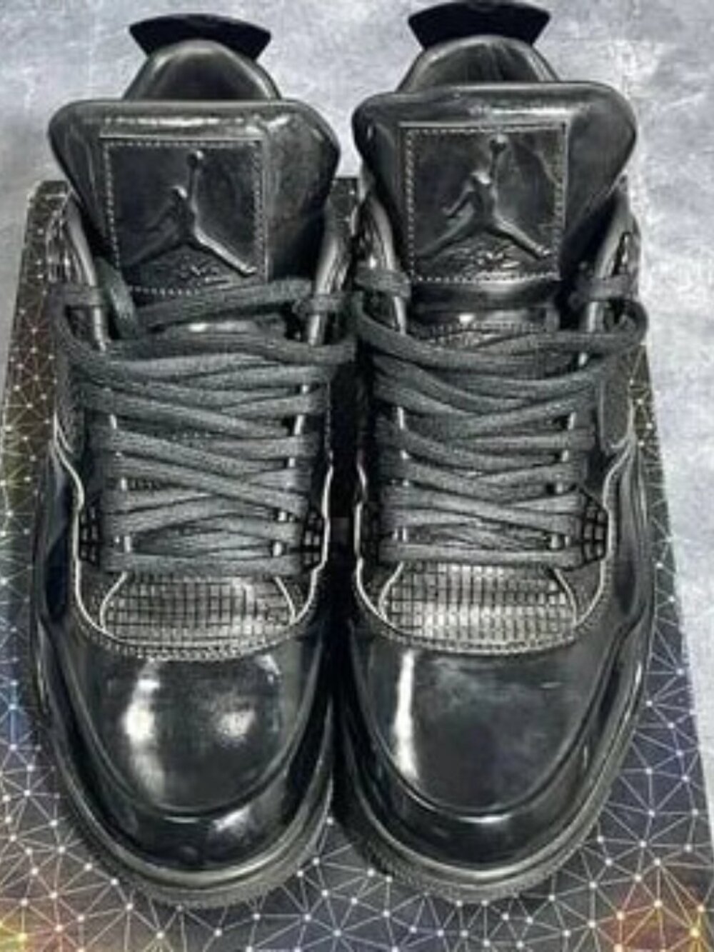 Air Jordan 4 Black Patent Leather Sneakers